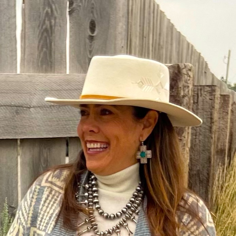 A custom Bri Moore Creations Cream Felt Hat with Embroidered Design